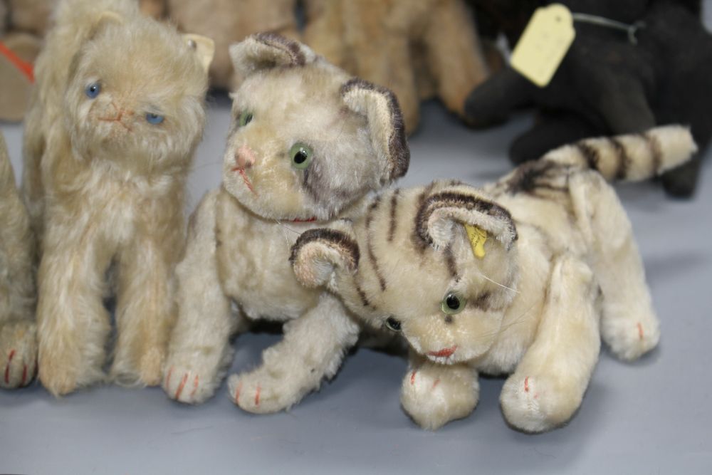 A collection of nine assorted vintage and later soft toy cats including Steiff